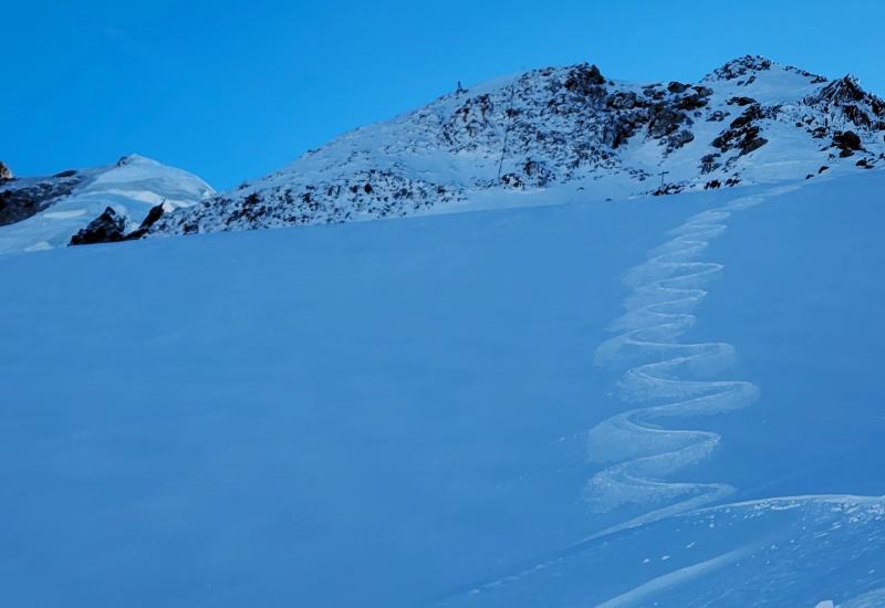 First skier on top of Grands Montets, first track in fresh snow